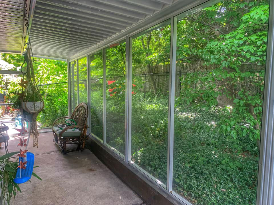 Screened in sunroom under patio cover inside