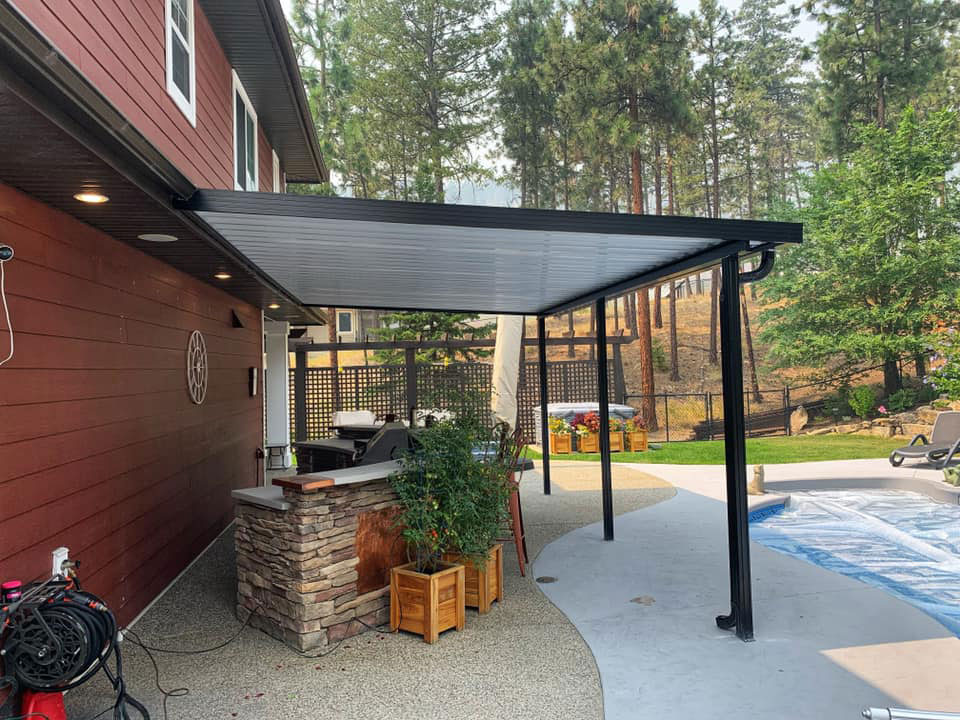 black frame patio cover beside pool